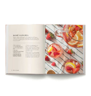 Page spread from Rosé Cocktails features a recipe for Rosé Sangria alongside a staged photograph of the drink