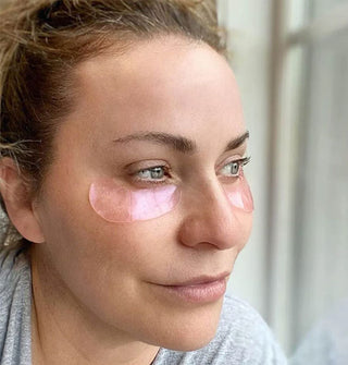 Model wears pink under-eye patches