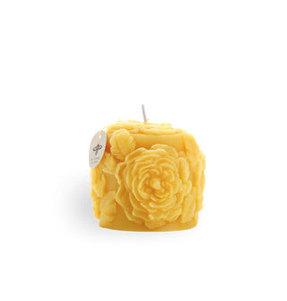 Beeswax candle with sculptural rose blooms and a single cotton wick