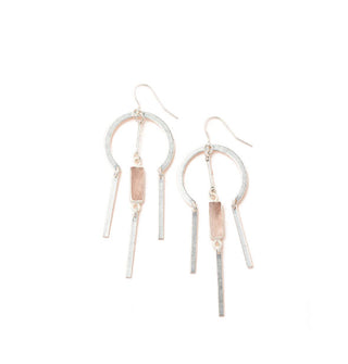 Silver earrings with a rounded upper section and rose quartz stone center dangle