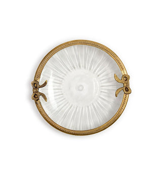 Round ribbed glass dish with brass rim featuring bow accents on either side