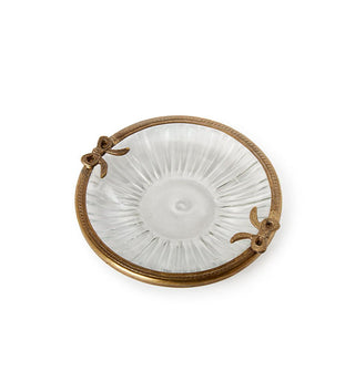 Round ribbed glass dish with brass rim featuring bow accents on either side