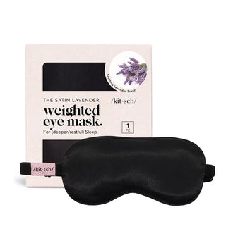 Black Satin Lavender Weighted Eye Mask by Kitsch shown next to and in front of its box packaging