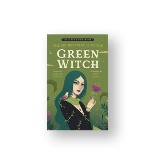 Green box of The Secret Oracle of the Green Witch cards features illustration of a green-haired woman wearing a green scarf holding a purple flower with a bird perched on her shoulder