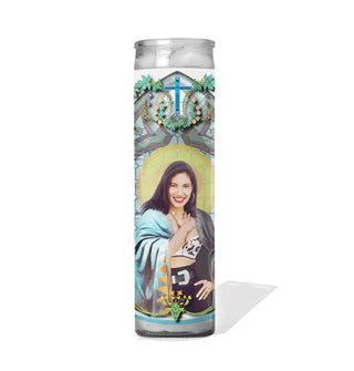 Tall glass prayer candle with colorful label depicting Selena Quintanilla as a saint