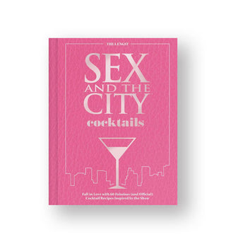 Pink cover of Sex and the City Cocktails features silvery lettering, New York skyline, and martini glass graphic