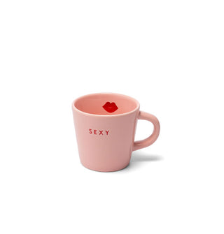 Pink espresso mug is stamped with the word "Sexy" in small red lettering and features red lips graphic on the inside rim