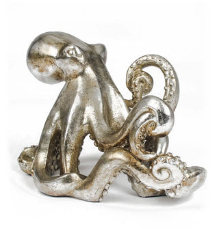 Silver-toned octopus-shaped figurine with suction cup tentacle details
