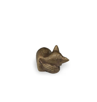 Brass sleeping fox figuring shown from the side with point of tail wrapped around its neck
