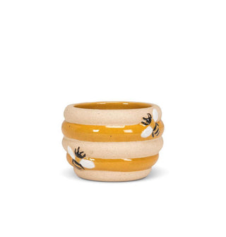 Beehive-shaped ceramic planter with alternating matte beige and glossy yellow ribs accented with embossed painted bees