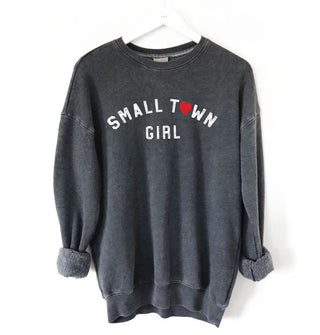 Dark gray sweatshirt that says, "Small town girl" in white lettering with a red heart in place of the "O" in "Town"