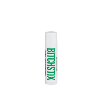White tube of Bitchstix lip balm with large green lettering
