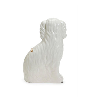 Back of a white ceramic Staffordshire dog statue features a wavy texture that resembles fur
