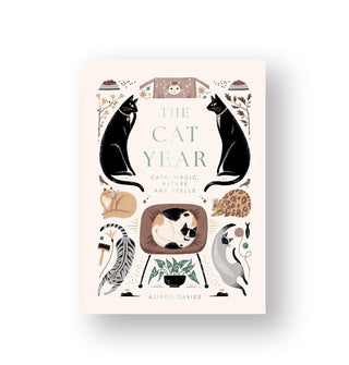Cover of The Cat Year: Cats, Magic, Nature and Spells features whimsical cat illustrations accented by everyday objects typically associated with cats
