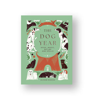 Green cover of the Dog Year (Dogs, Magic, Nature and Spells) by Alison Davies features a title border of various illustrated dog breeds in different poses