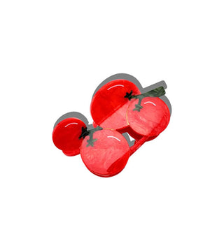 Hair clip designed as red cherry tomatoes with green stems