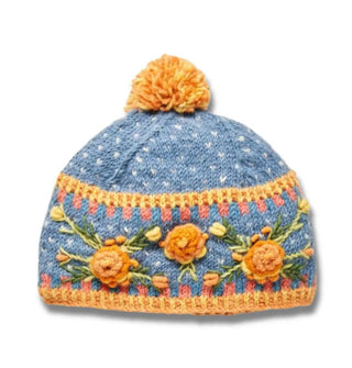 Blue wool beanie with textural yellow and green floral embroidery, geometric border designs, and a two-tone yellow pom pom on top