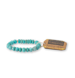 Turquoise stone bead bracelet with brown tag attached