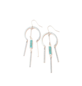 Silver earrings with a rounded upper section and turquoise stone center dangle