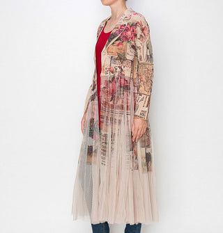 Model wears a rose-themed collage-style blazer with attached sheer tulle midi-length skirt