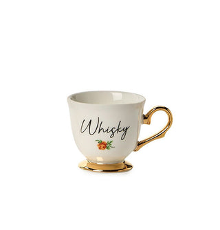 Small porcelain teacup with gold base and handle says, "Whisky" in black script with a small flower design underneath