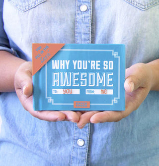 Model holds a copy of Why You're So Awesome