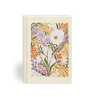 White fabric hardcover journal features wildflower embroidery in a colorful palette
