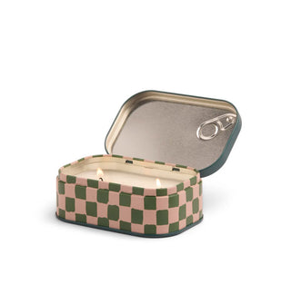 Opened lit candle tin with pink and green checker print base