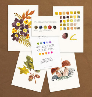 Some contents of Antiquaria Mercantile's Premium Watercolor Kit, including three completed paintings