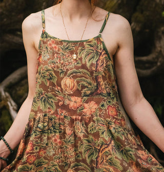 Model wears a brown floral printed sleeveless dress